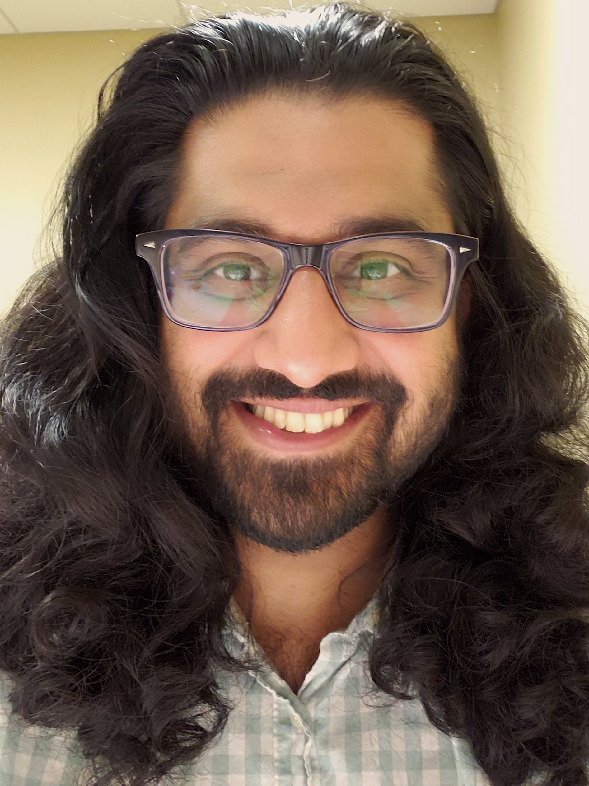 Chandresh N. Ladva smiling.