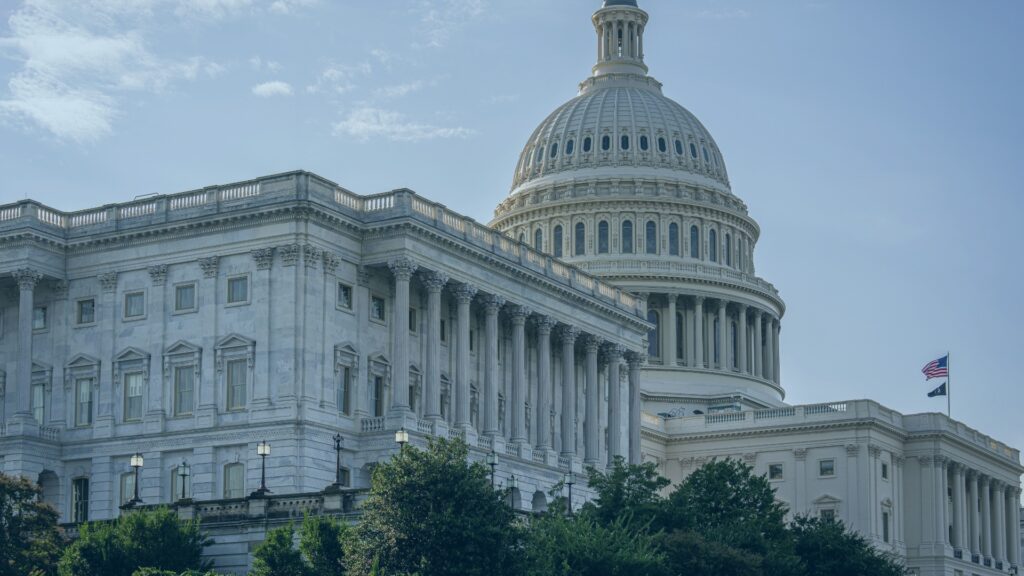 Daytime view of the US Capitol Building in Washington DC, showcasing its architectural grandeur and iconic dome.