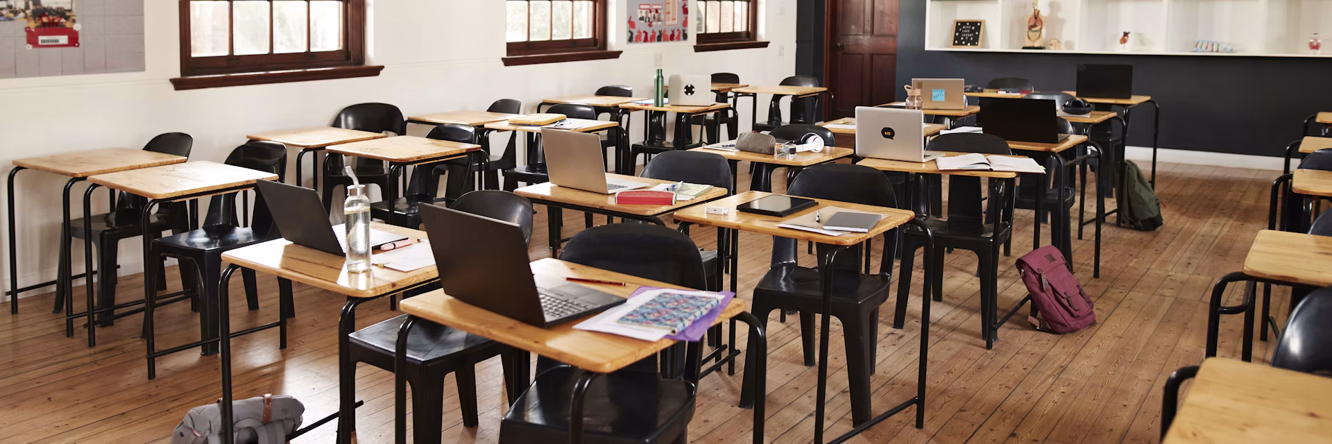 Classroom with desks and chairs at high school.